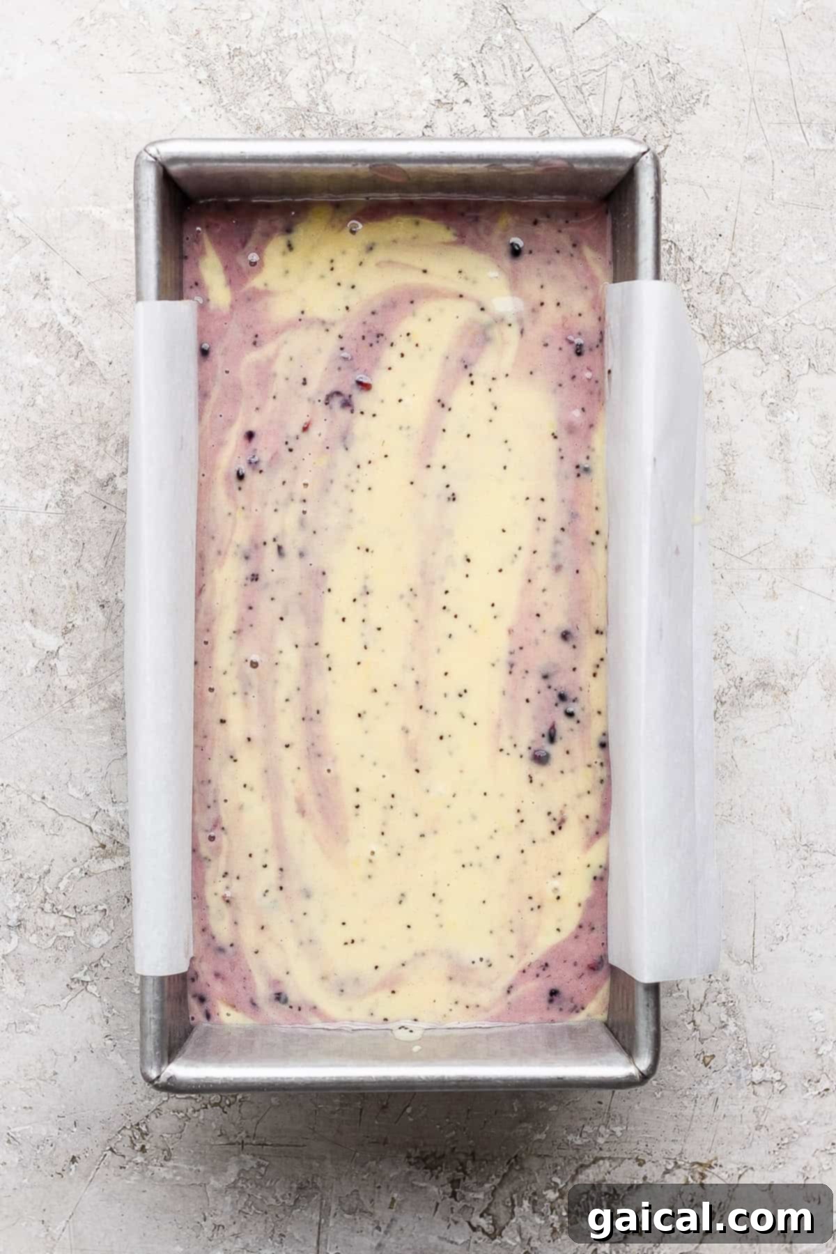 The swirled blackberry lemon poppy seed batter ready for the oven.