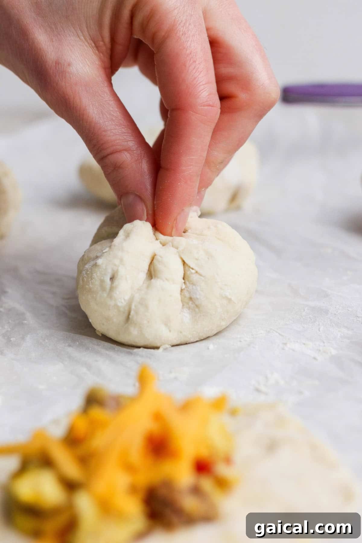 Sealing the stuffed English muffins