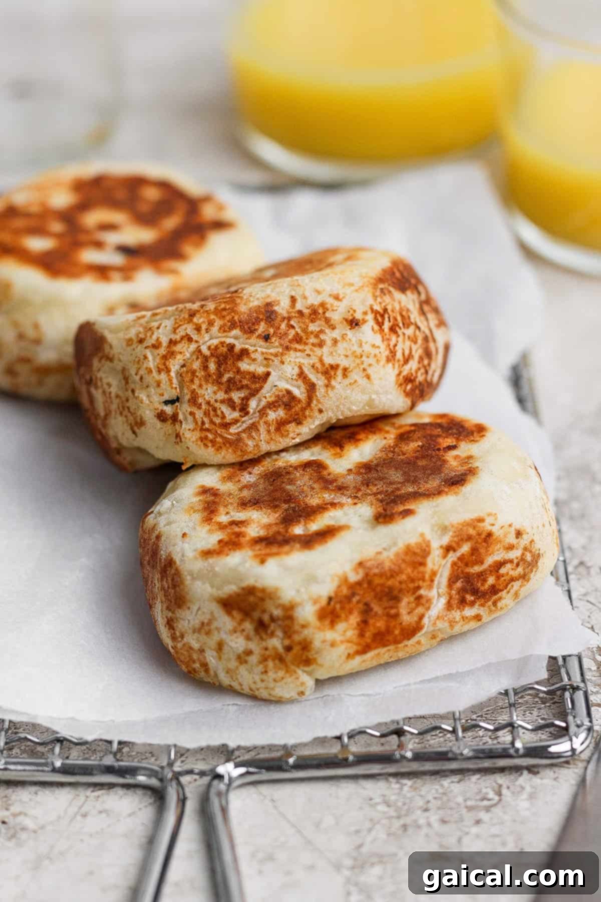 Finished stuffed English muffins on a cooling rack