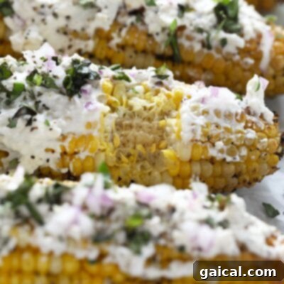 Next Level Street Corn Creations 11 Grilled corn on the cob with a Mediterranean twist, topped with feta cheese and fresh basil.