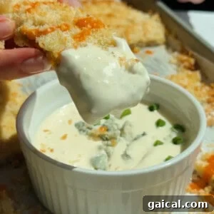 Buffalo Chicken Protein Bars — Crispy Baked Savory Snack 10 Chicken protein bars served with blue cheese dip garnished with fresh herbs and crumbled cheese