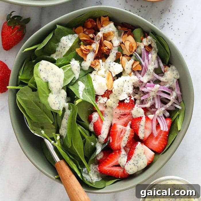 A bowl of strawberry spinach salad