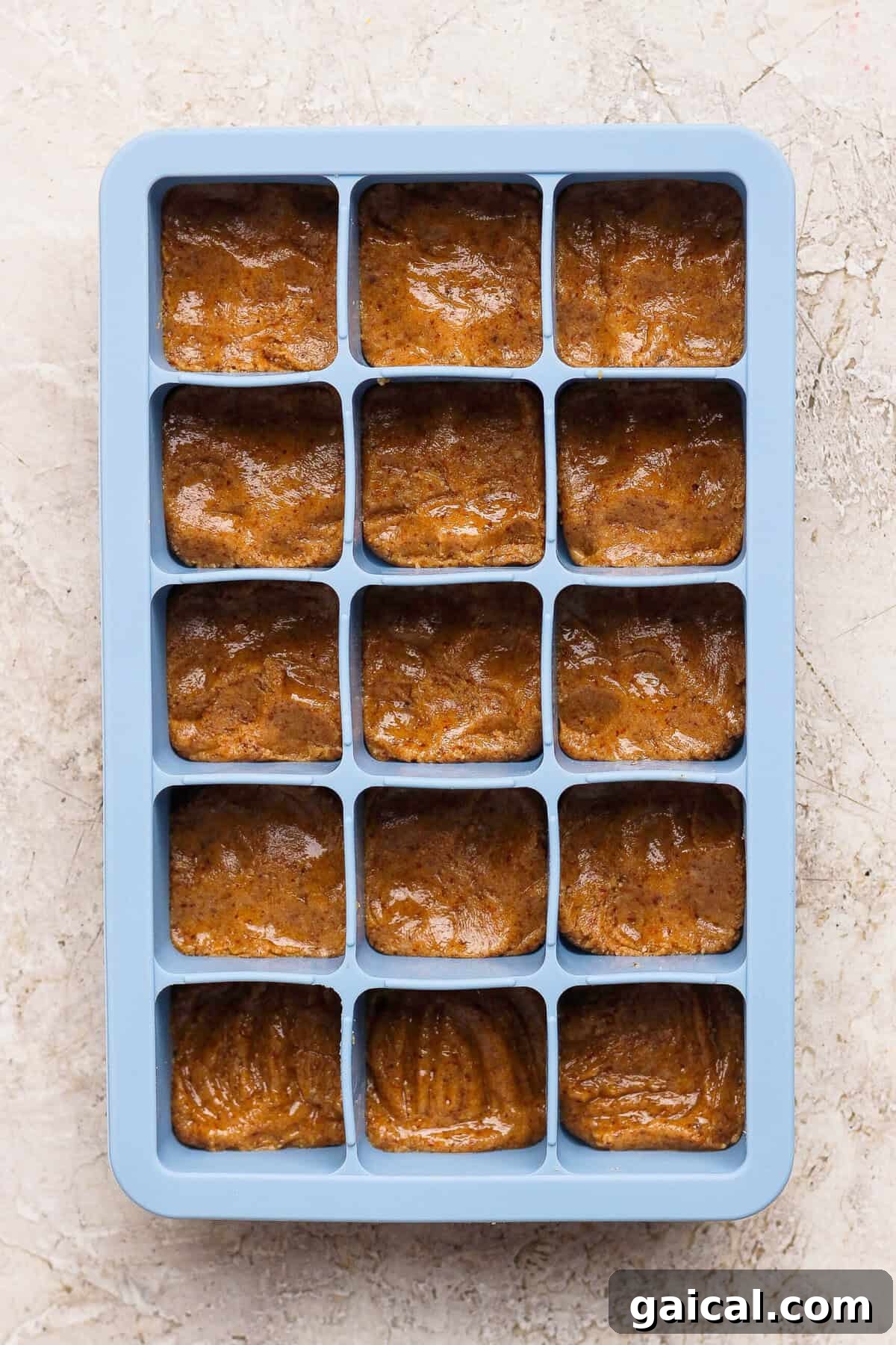 No-Bake Thin Mint Protein Bites 5 thin mint protein bite base pressed flat into a blue silicone ice cube tray