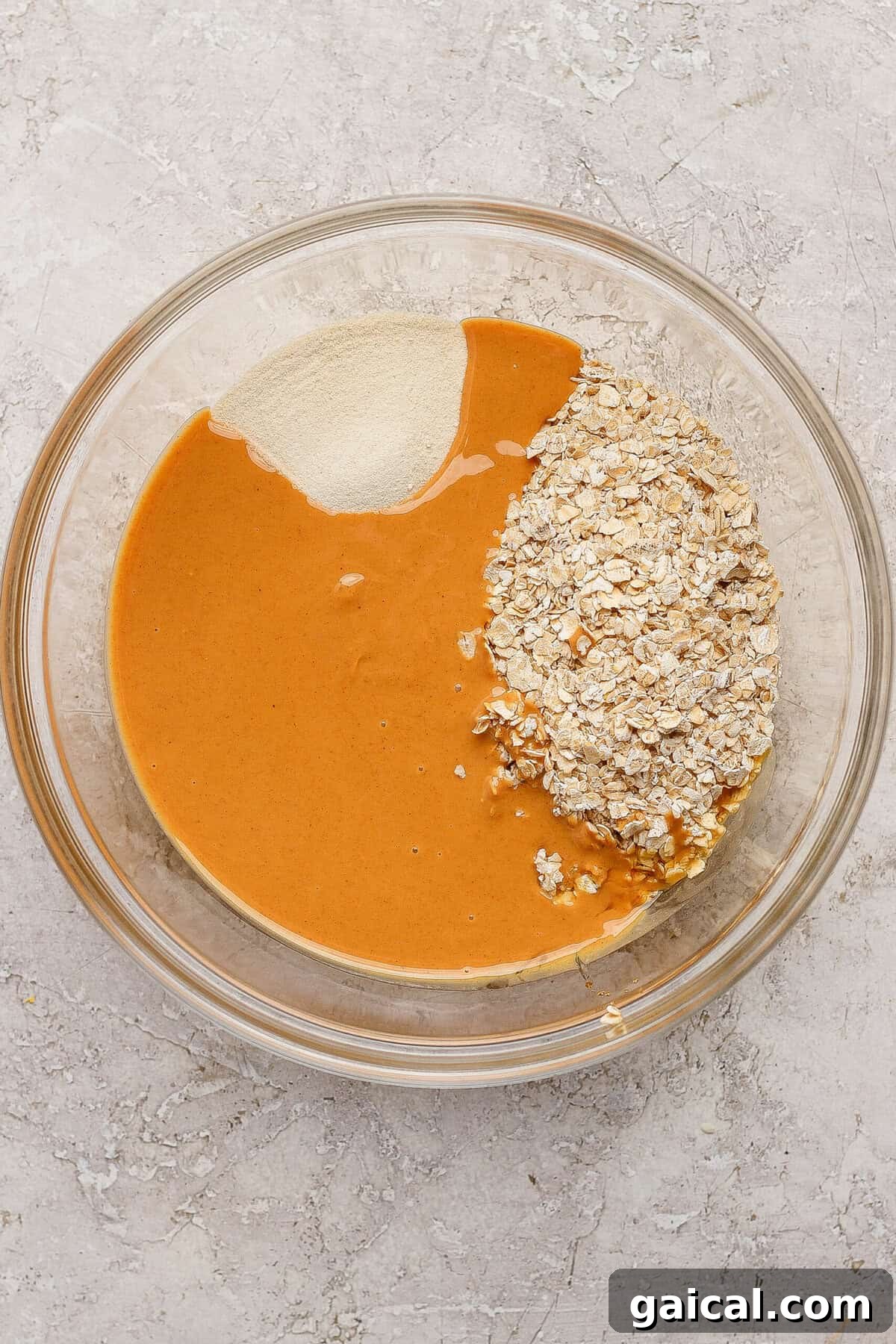 peanut butter oats and protein powder in a mixing bowl for crumble topping