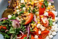 Summer Corn and Tomato Salad with Zesty Chili Crunch Dressing