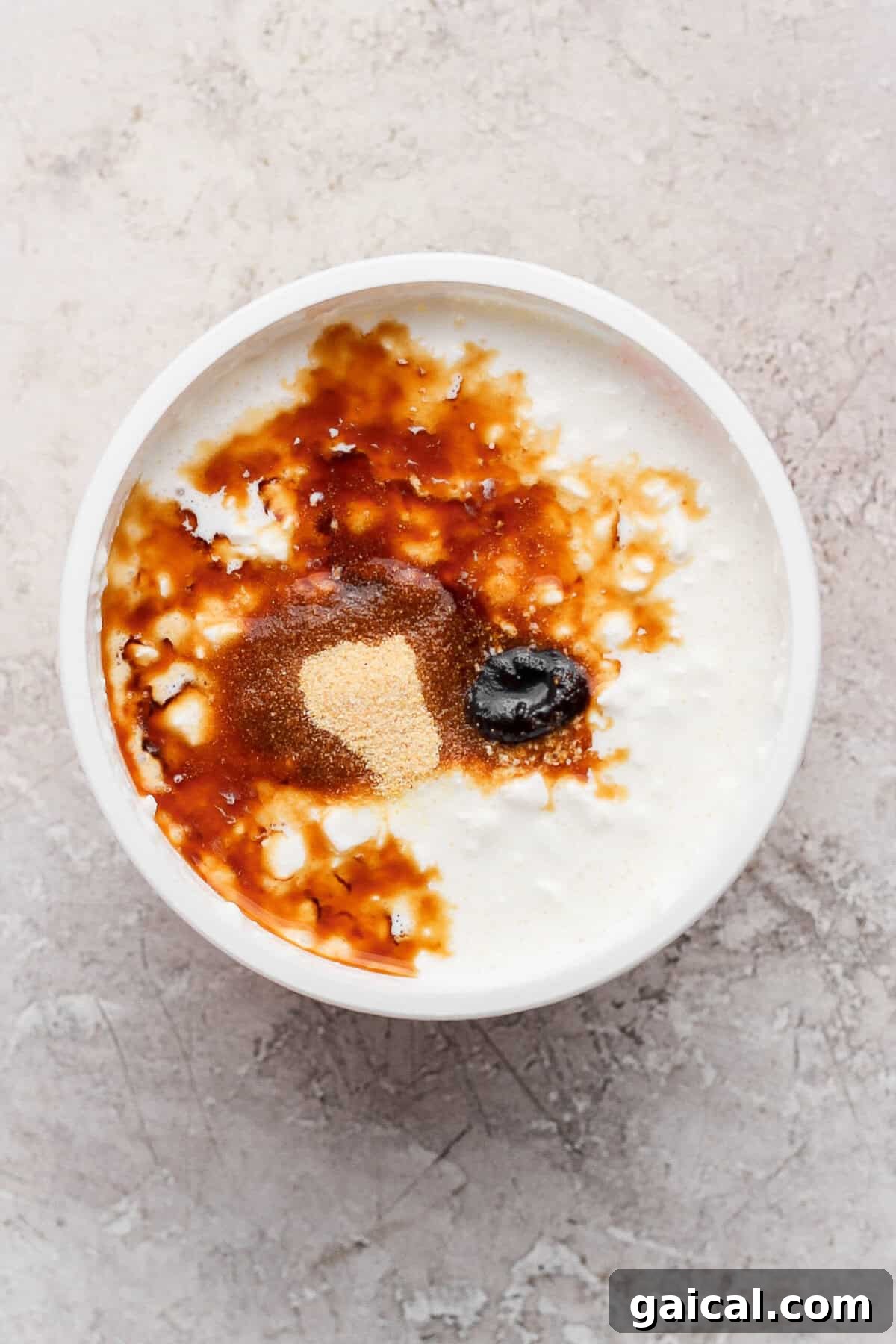 Cottage cheese topped with Worcestershire sauce, beef broth concentrate, and garlic powder before blending.